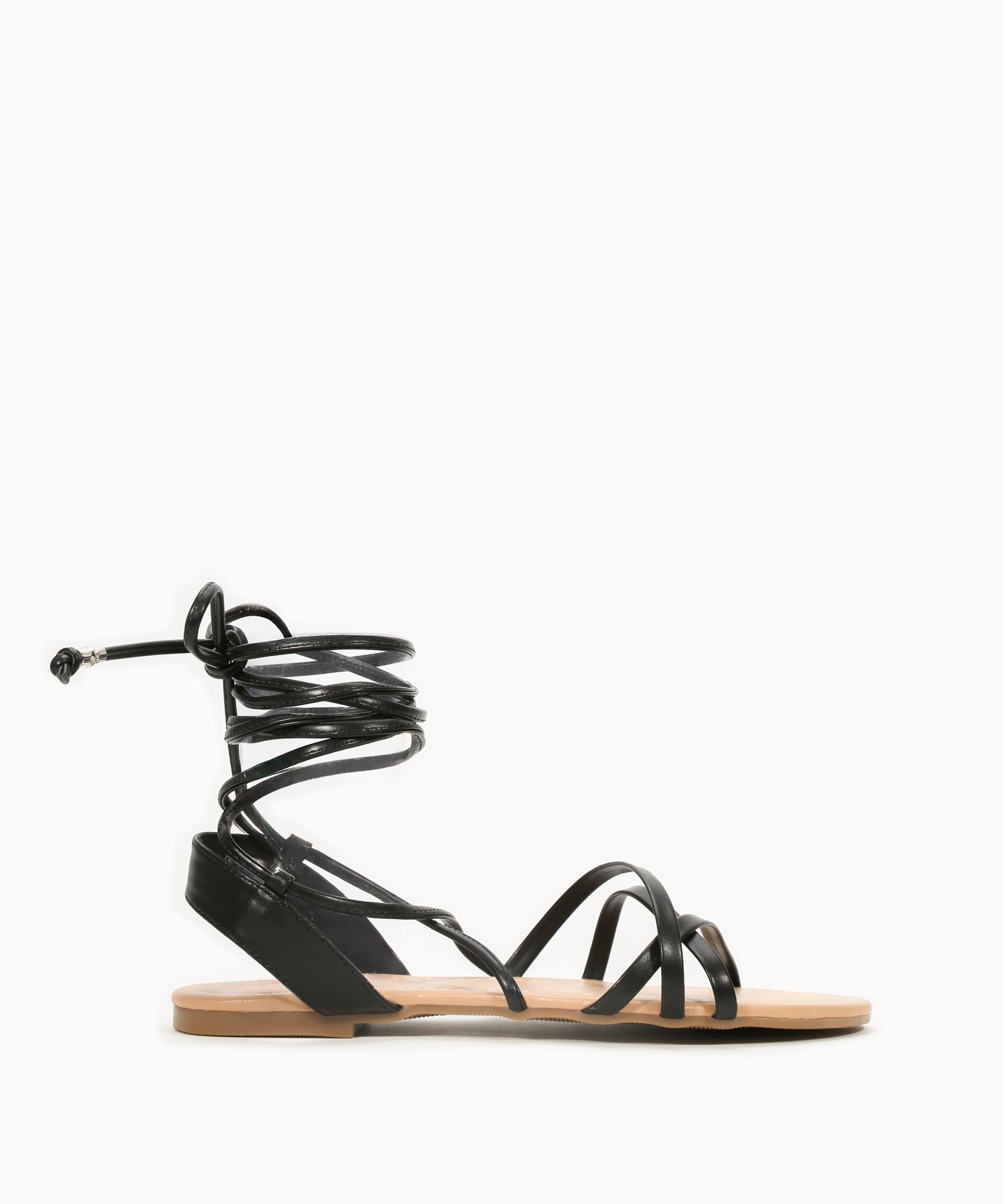 Sandalia plana atada al tobillo